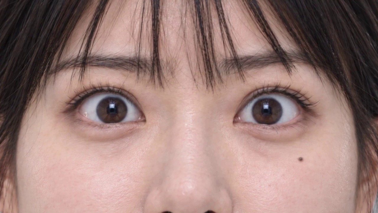 Extreme close-up of her eyes, the loop point of the AI film